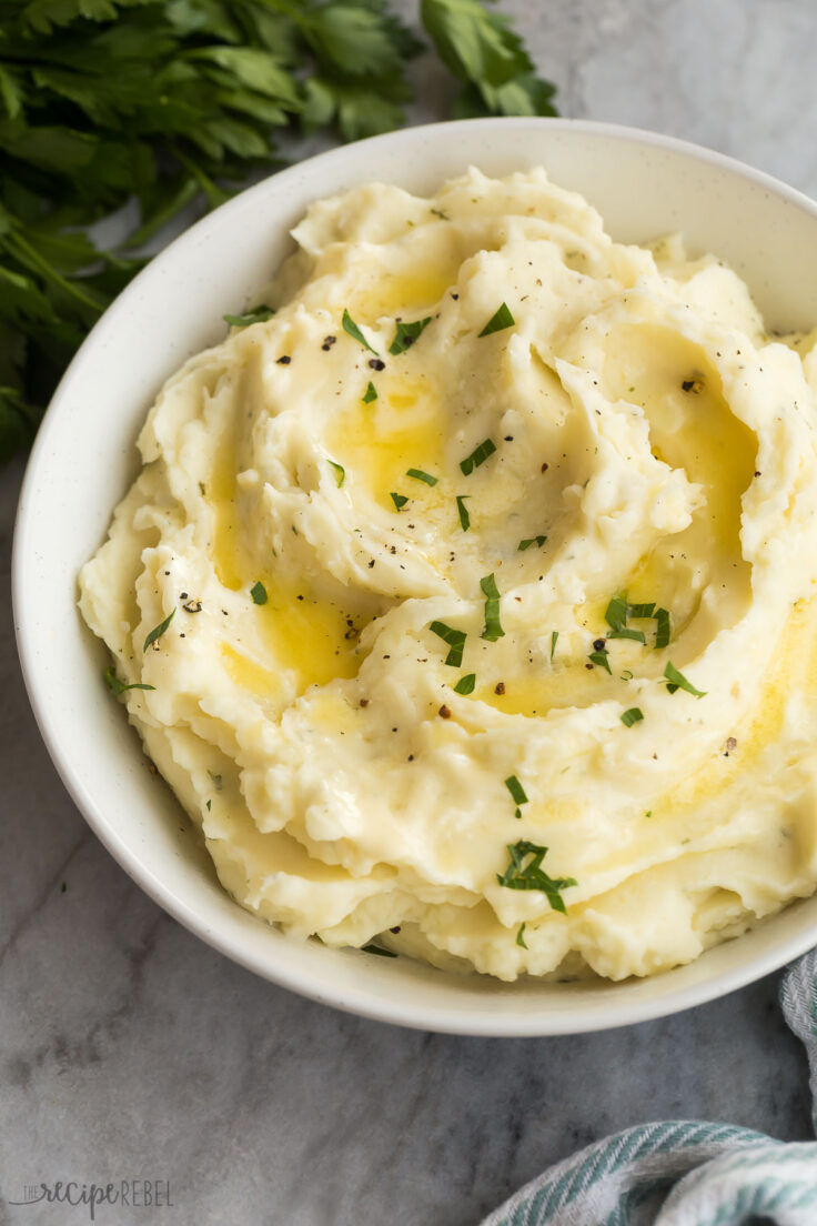 close up image of garlic mashed potatoes in a bowl