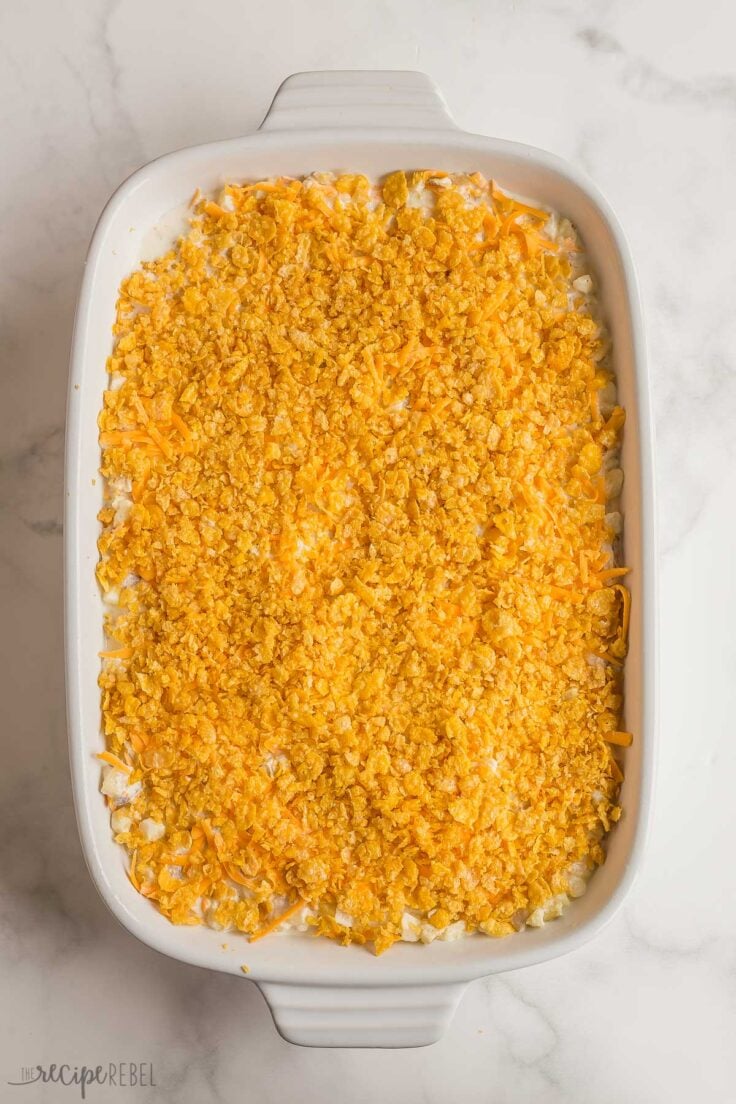 unbaked hashbrown casserole with corn flake topping