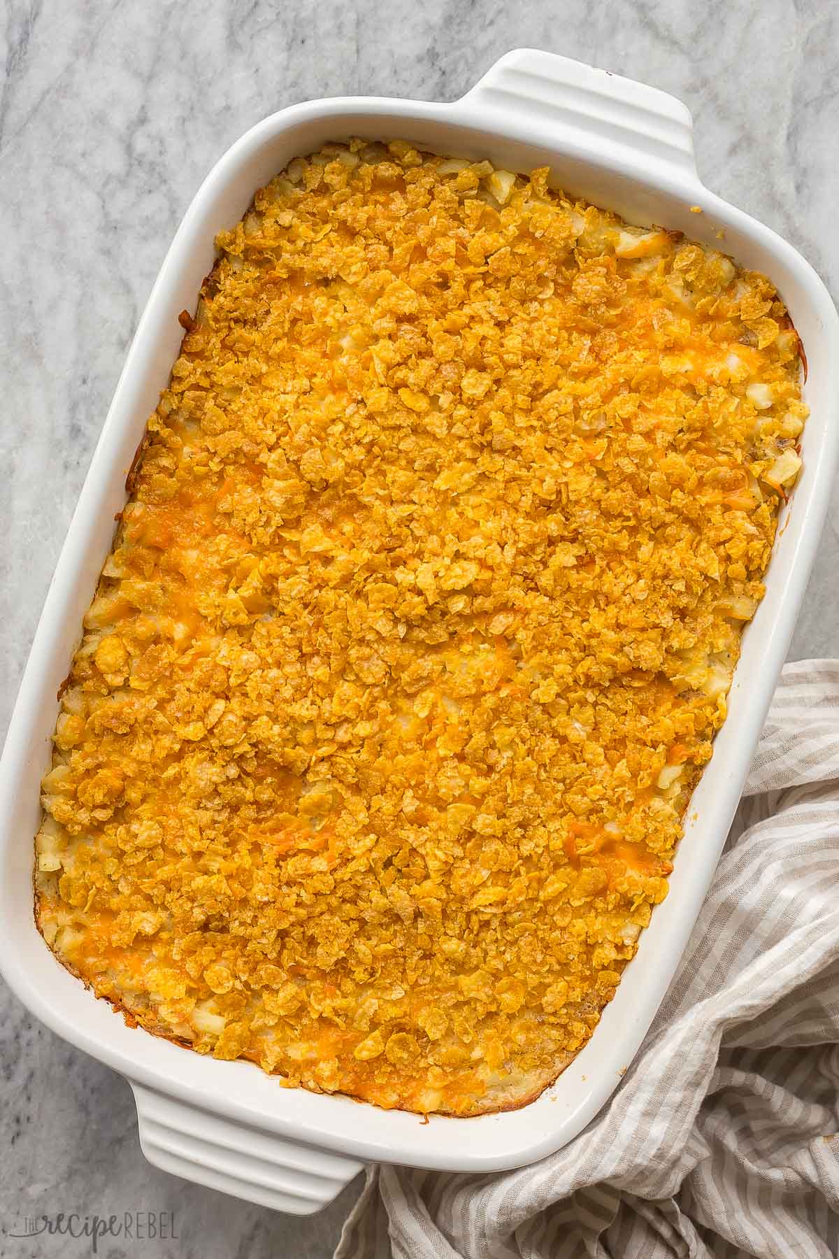 whole hashbrown casserole on a marble background