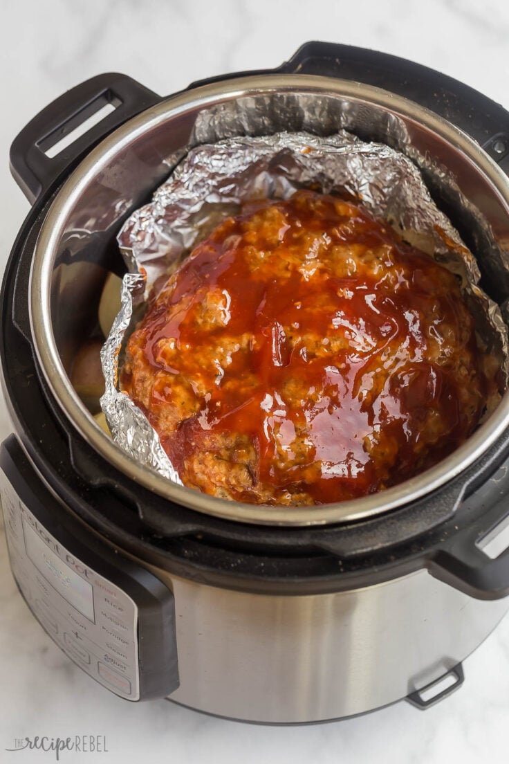 close up image of finished meatloaf in instant pot with glaze