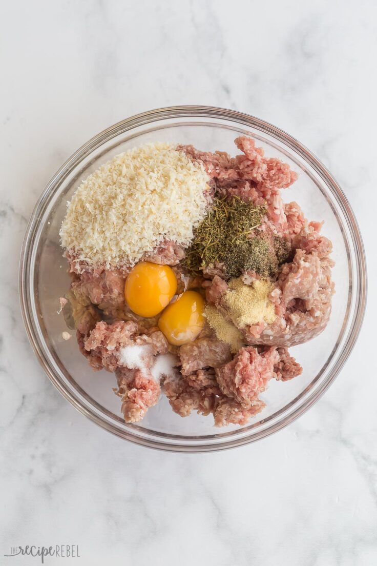 ingredients for meatloaf mixture in a glass bowl