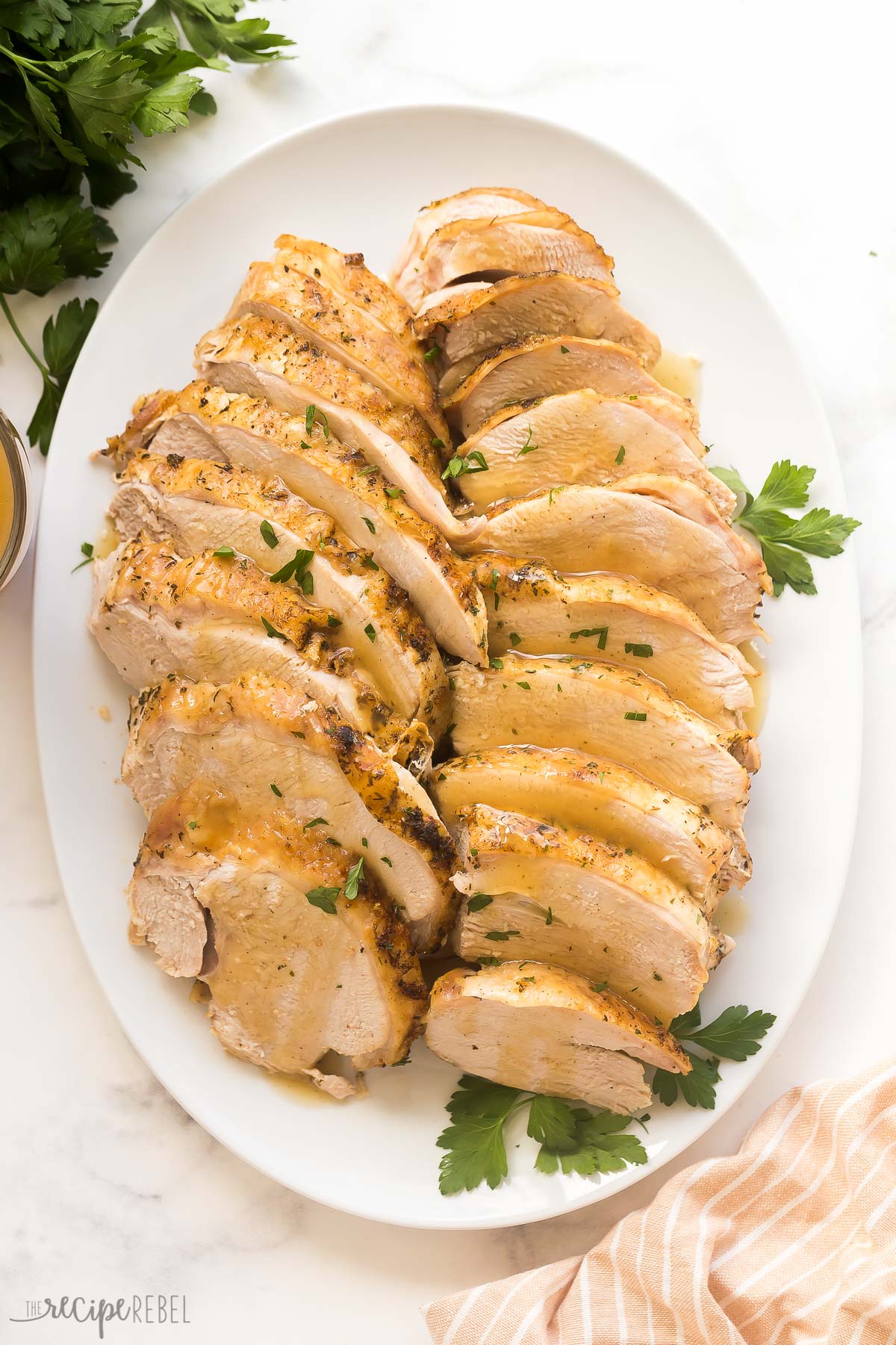 overhead image of instant pot turkey breast on white platter