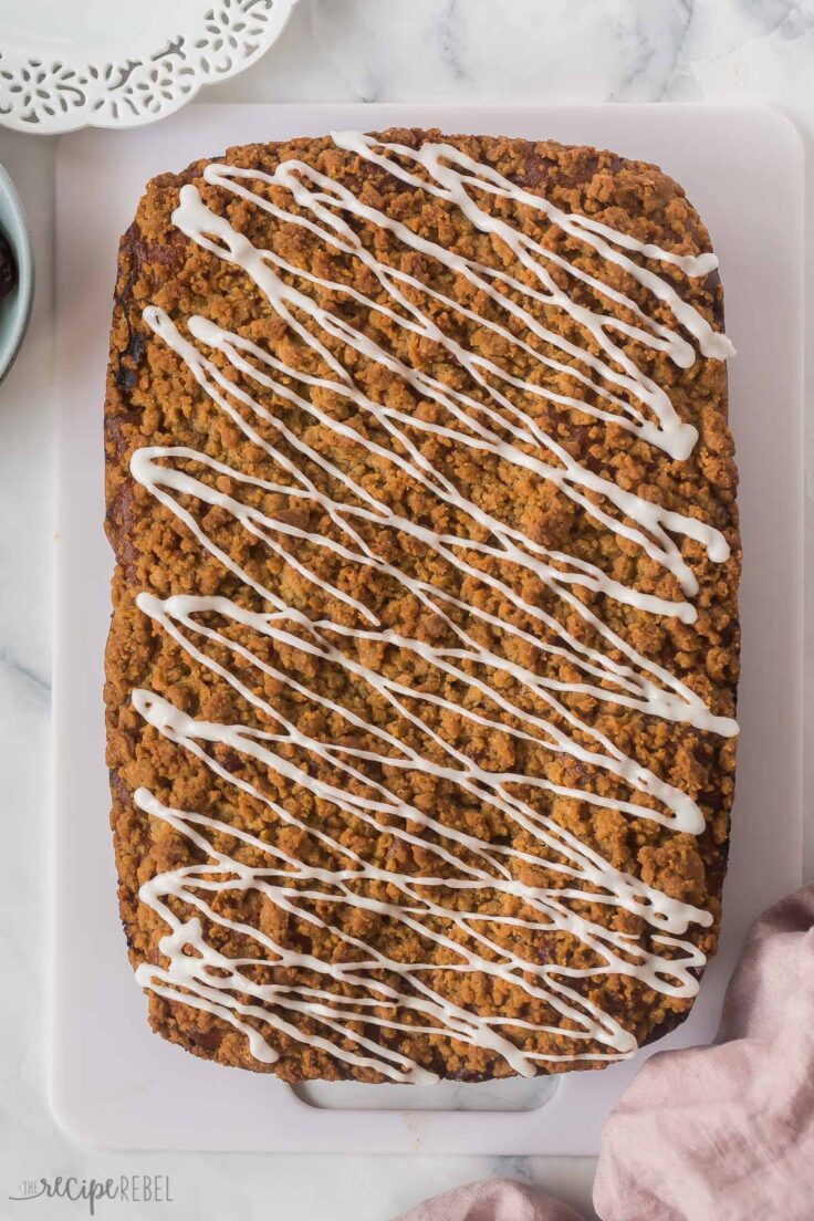 overhead image of whole date coffee cake with glaze drizzled on top