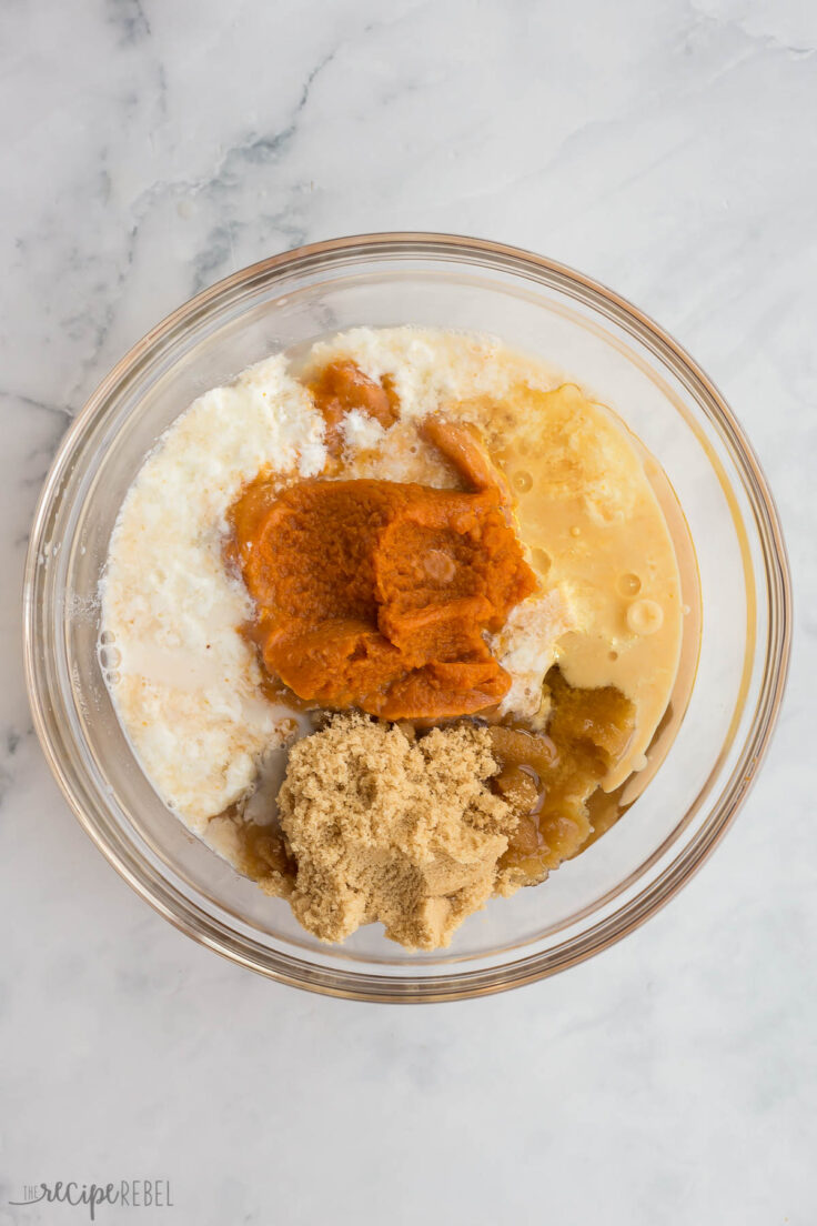 wet ingredients for pumpkin muffins in glass bowl