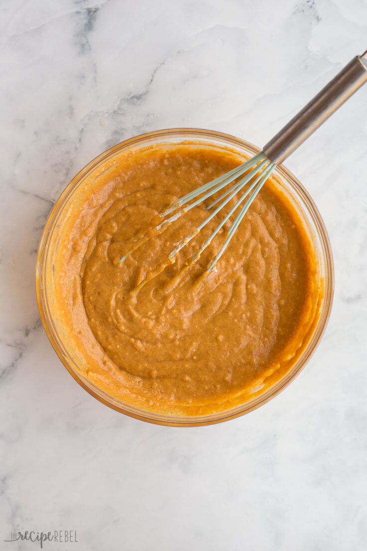 finished pumpkin muffin batter in bowl with whisk