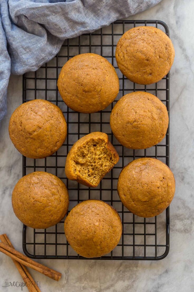 overhead image of pumpkin muffins on cooling rack