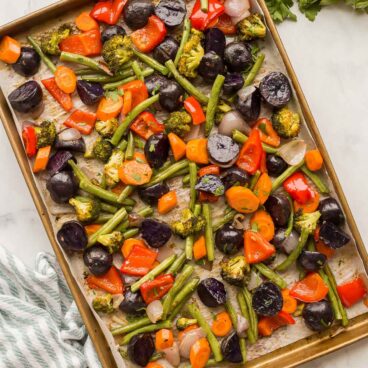 overhead image of roasted vegetables on sheet pan