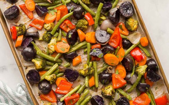 overhead image of roasted vegetables on sheet pan