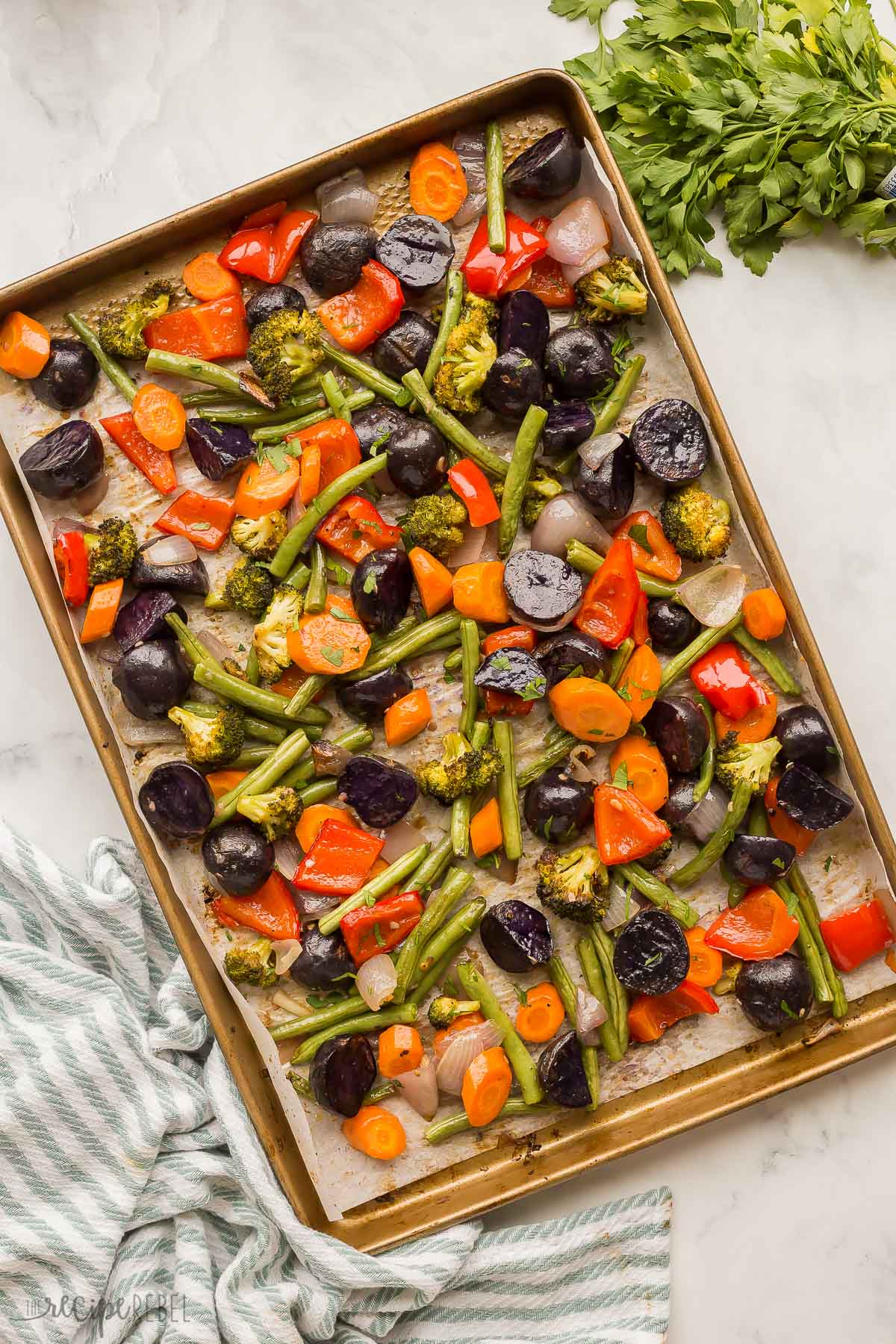 overhead image of roasted vegetables on sheet pan