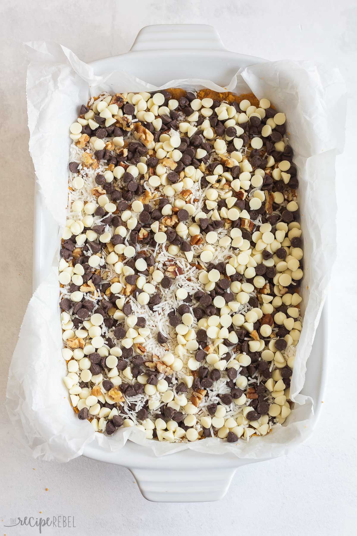 chocolate chips and coconut on graham cracker crust.