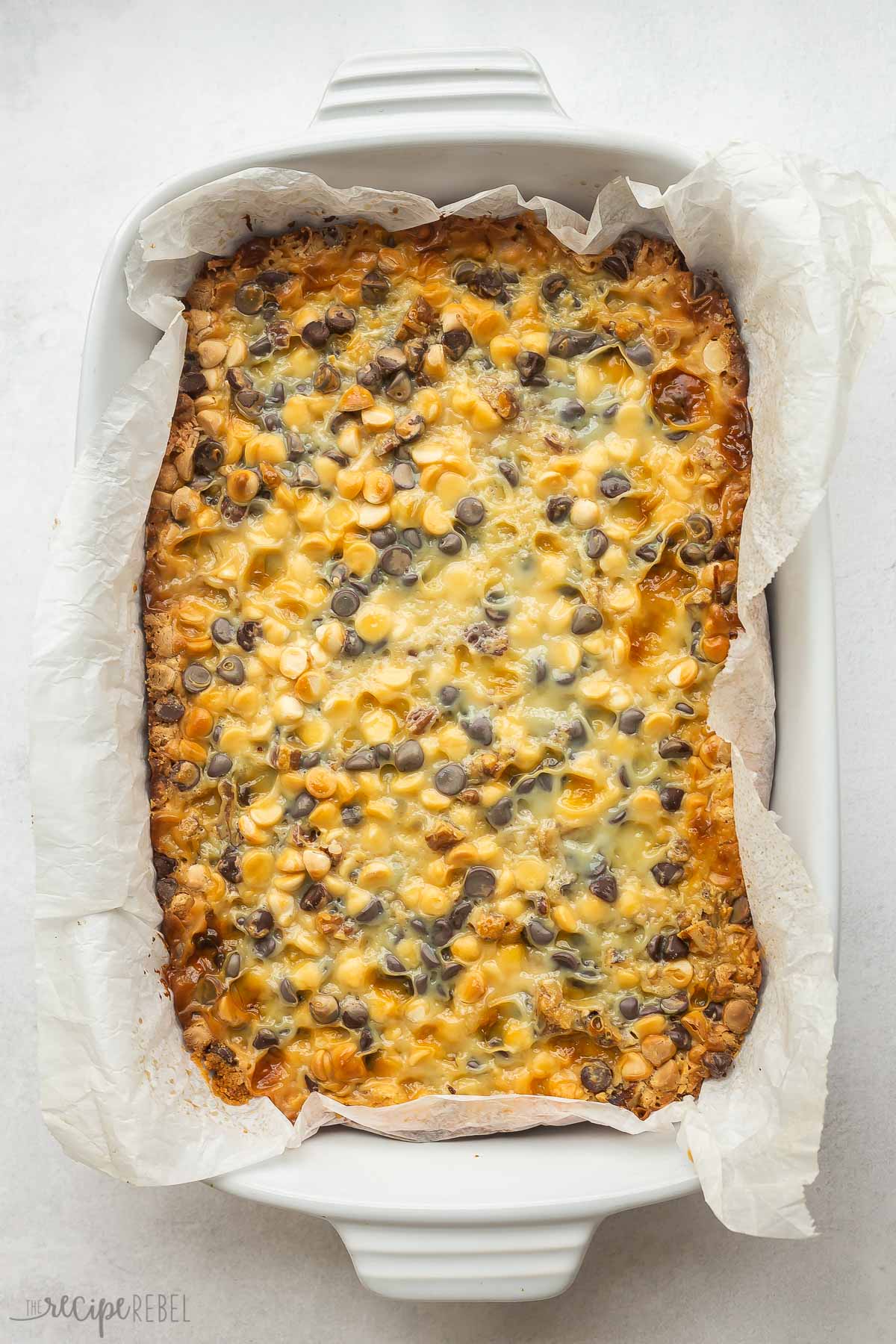 finished baked magic bars in white baking dish.