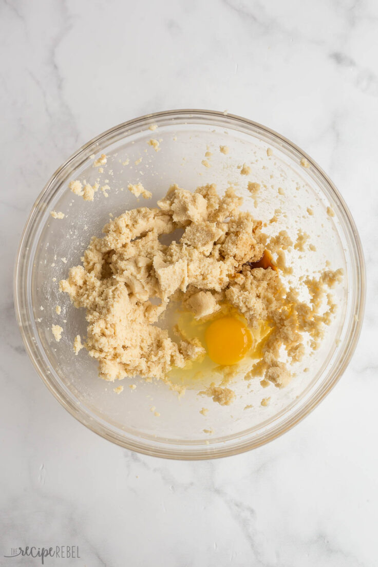 egg added to butter and sugar for cookie dough