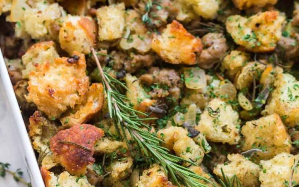 close up image of sourdough stuffing in baking dish