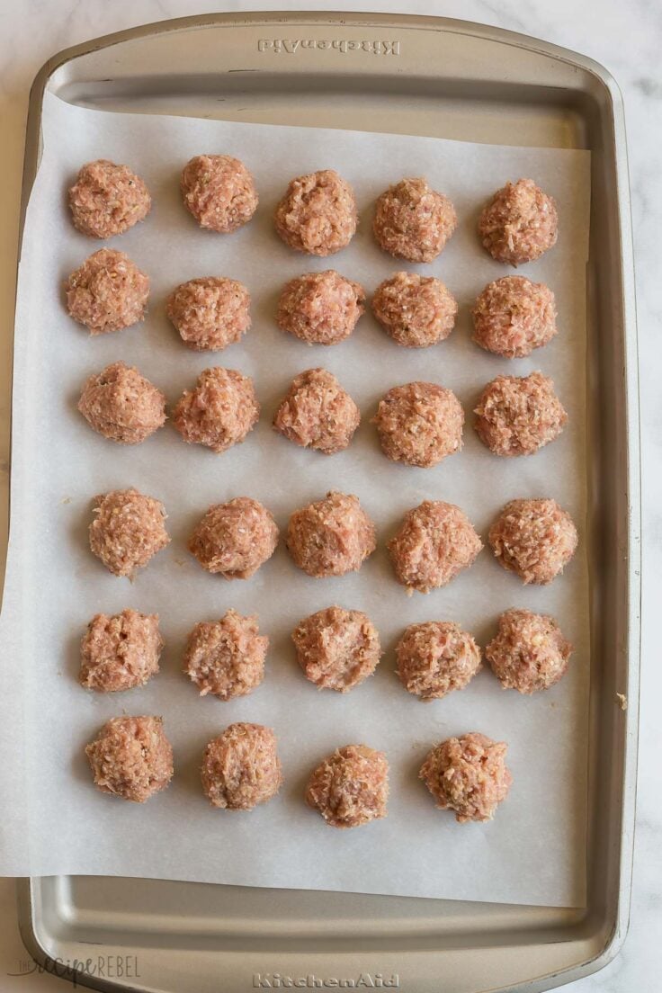 uncooked turkey meatballs on baking sheet