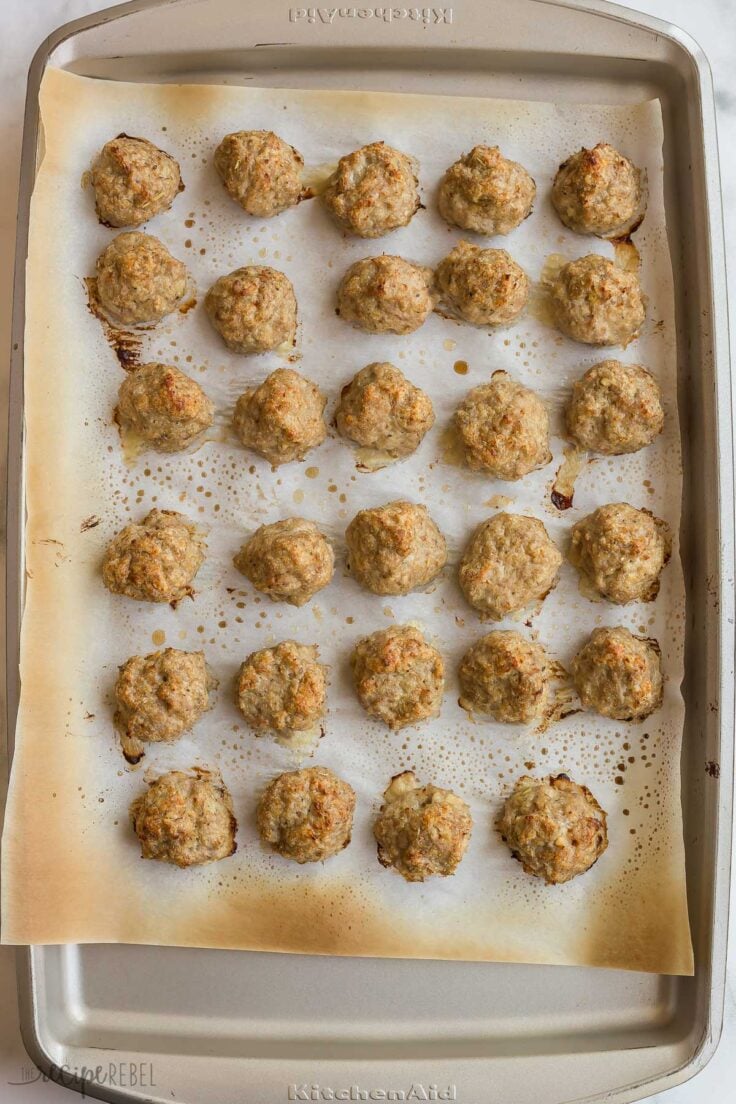 baked turkey meatballs on baking sheet