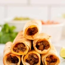 tall stack of air fryer beef taquitos on plate