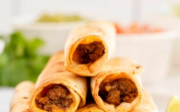 tall stack of air fryer beef taquitos on plate