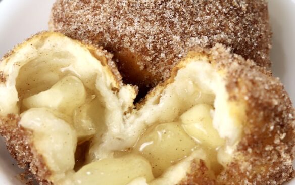 churro apple pie bomb broken in half to reveal filling