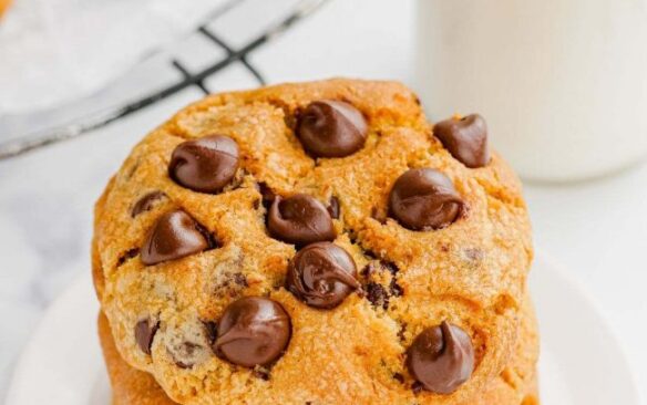 stack of air fryer chocolate chip cookies with milk on the side