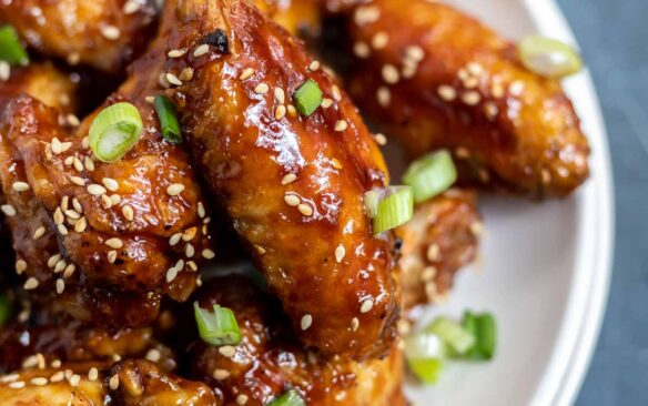 Teriyaki chicken wings on a plate.