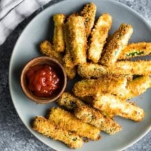 overhead image of air fryer zucchini fries on plate