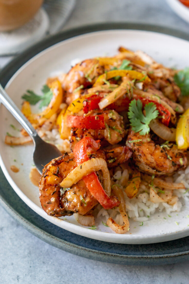 air fryer shrimp and peppers on plate with rice