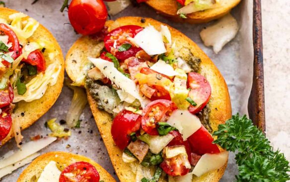 Overhead view of BLT bruschetta on a baking sheet