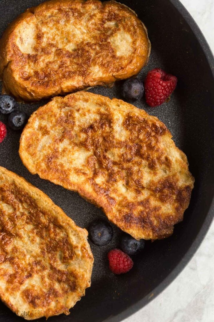 three slices of french toast in black skillet