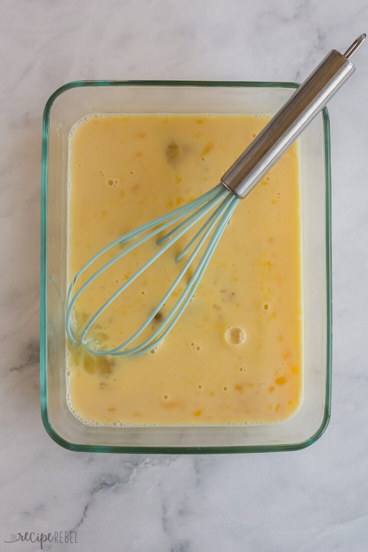 eggs and milk whisked together in glass dish