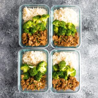 Meal prep containers filled with rice, broccoli, and Korean ground turkey.