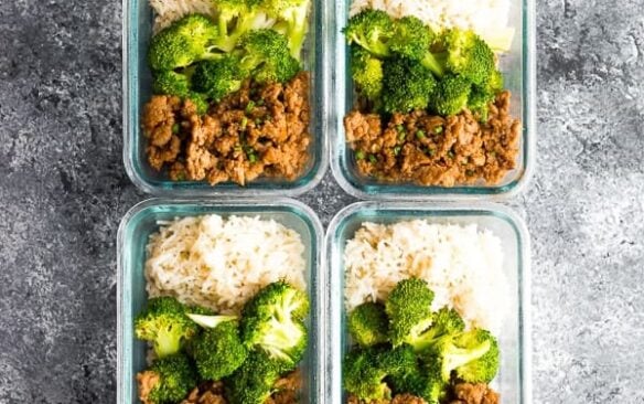 Meal prep containers filled with rice, broccoli, and Korean ground turkey.