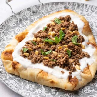 Ground turkey keema with yogurt and pine nuts served on Naan bread.