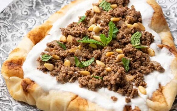 Ground turkey keema with yogurt and pine nuts served on Naan bread.