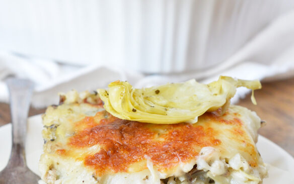 A slice of creamy turkey and wild rice casserole on a plate.