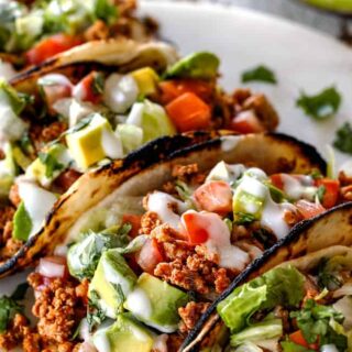 Turkey tacos filled with ground turkey and chopped vegetables.