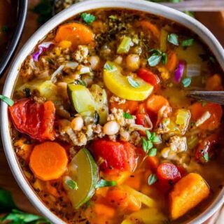 A bowl of nourishing weight loss turkey soup with vegetables.