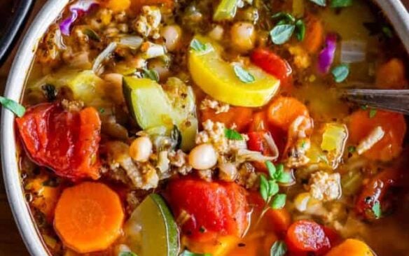 A bowl of nourishing weight loss turkey soup with vegetables.