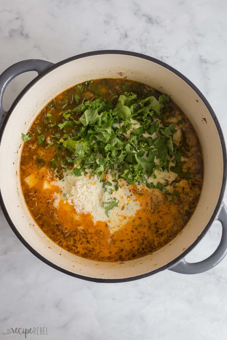 broth, cream and spinach added to soup in dutch oven