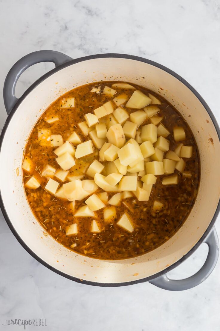 potatoes added to broth and sausage to make zuppa toscana