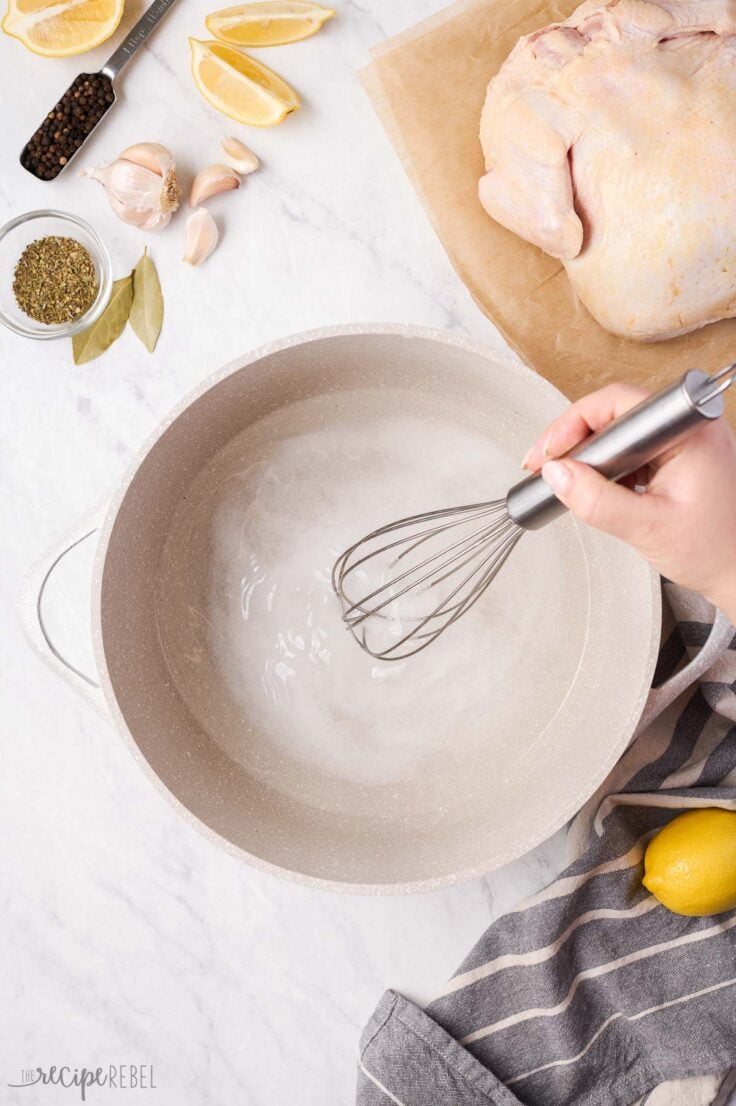 dissolving salt in hot water to make chicken brine