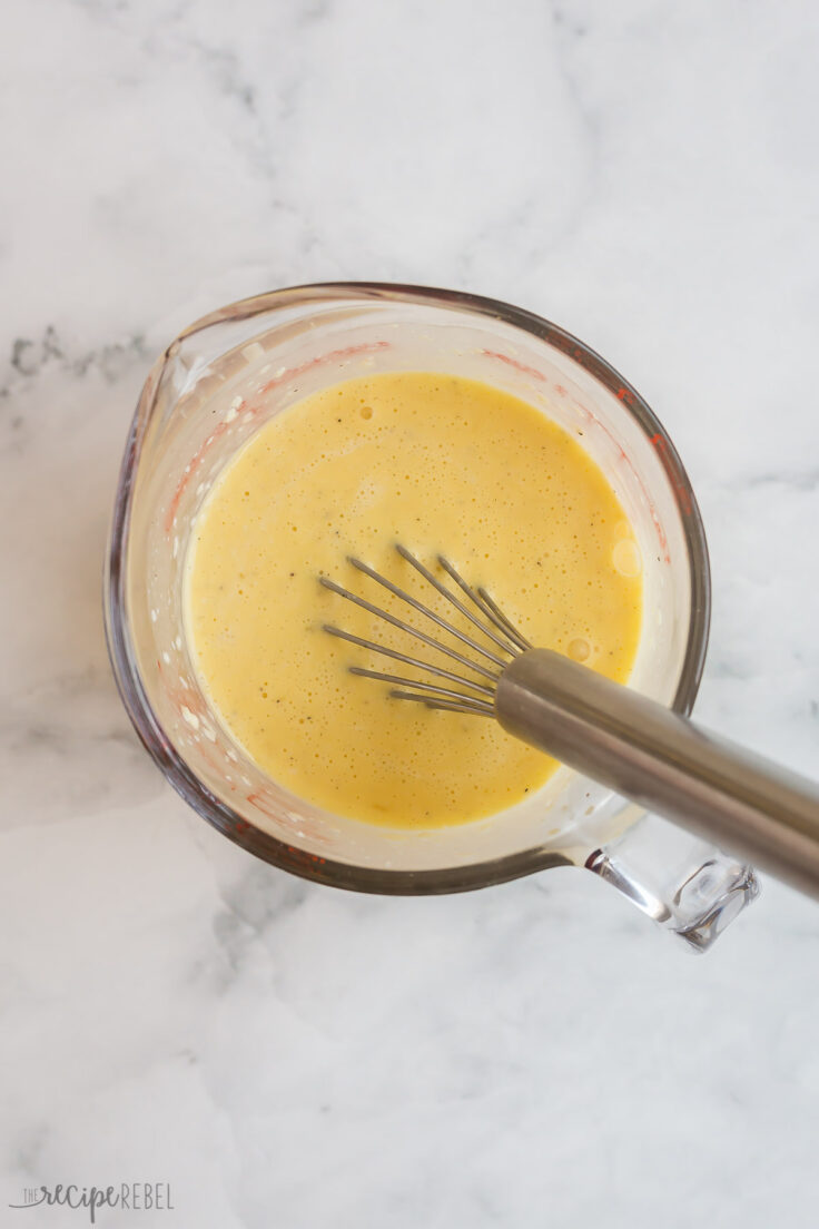 carbonara sauce whisked together in glass measuring cup