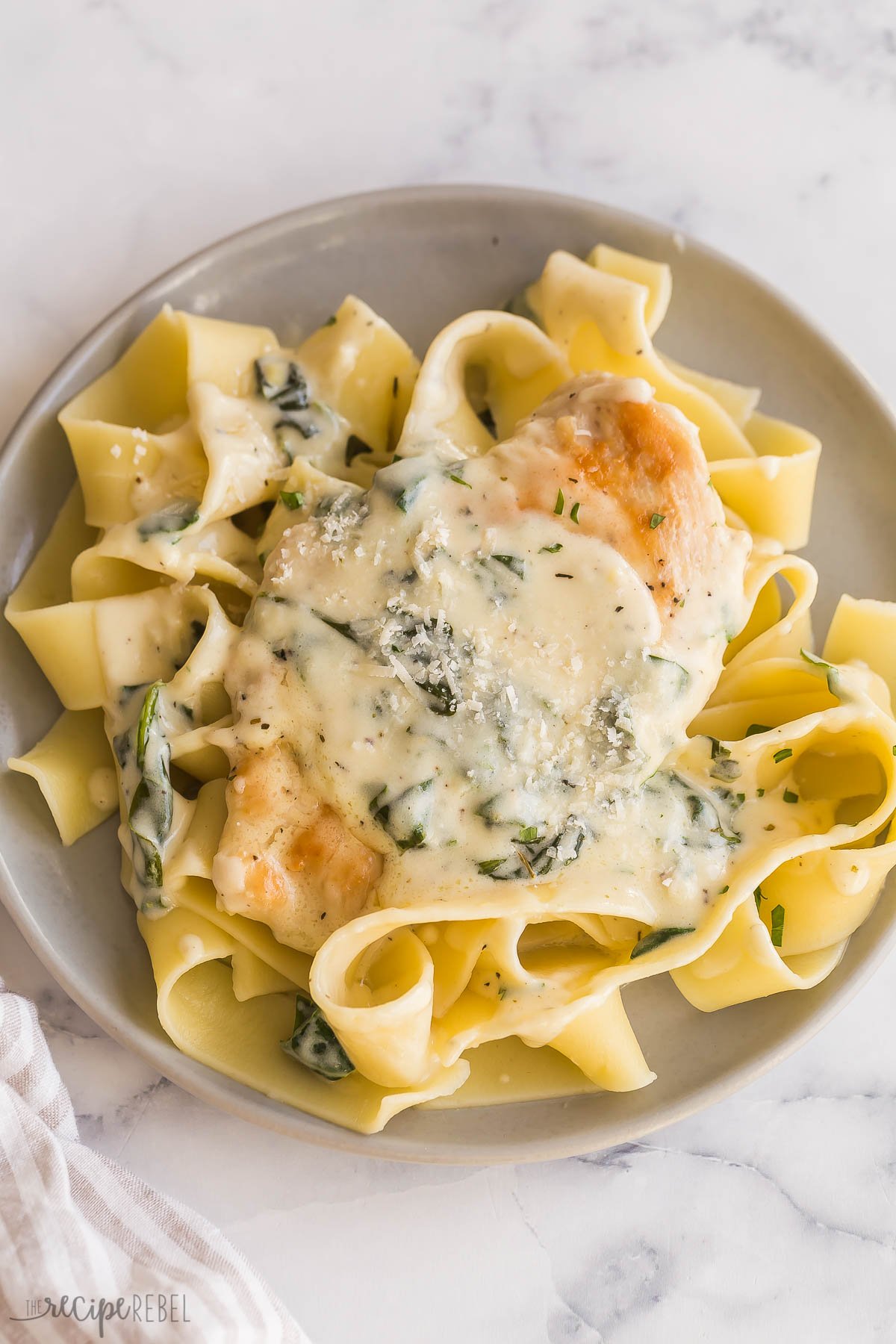 chicken florentine chicken breast with sauce over pappardelle