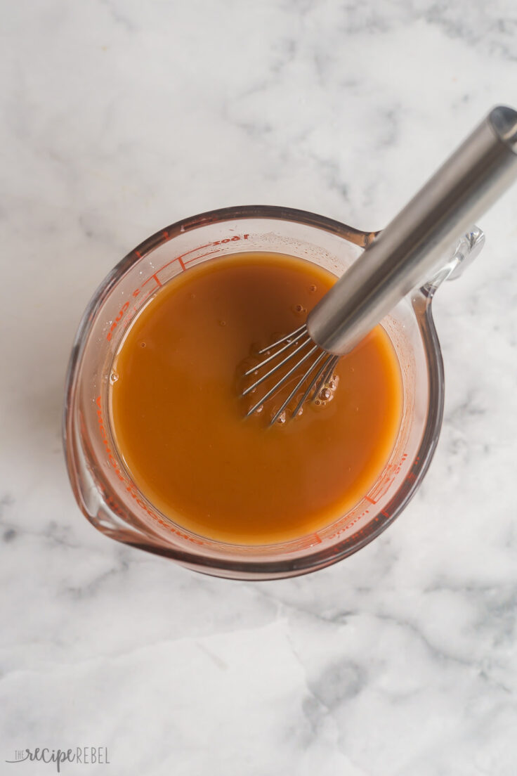 sweet and sour sauce stirred together in measuring cup