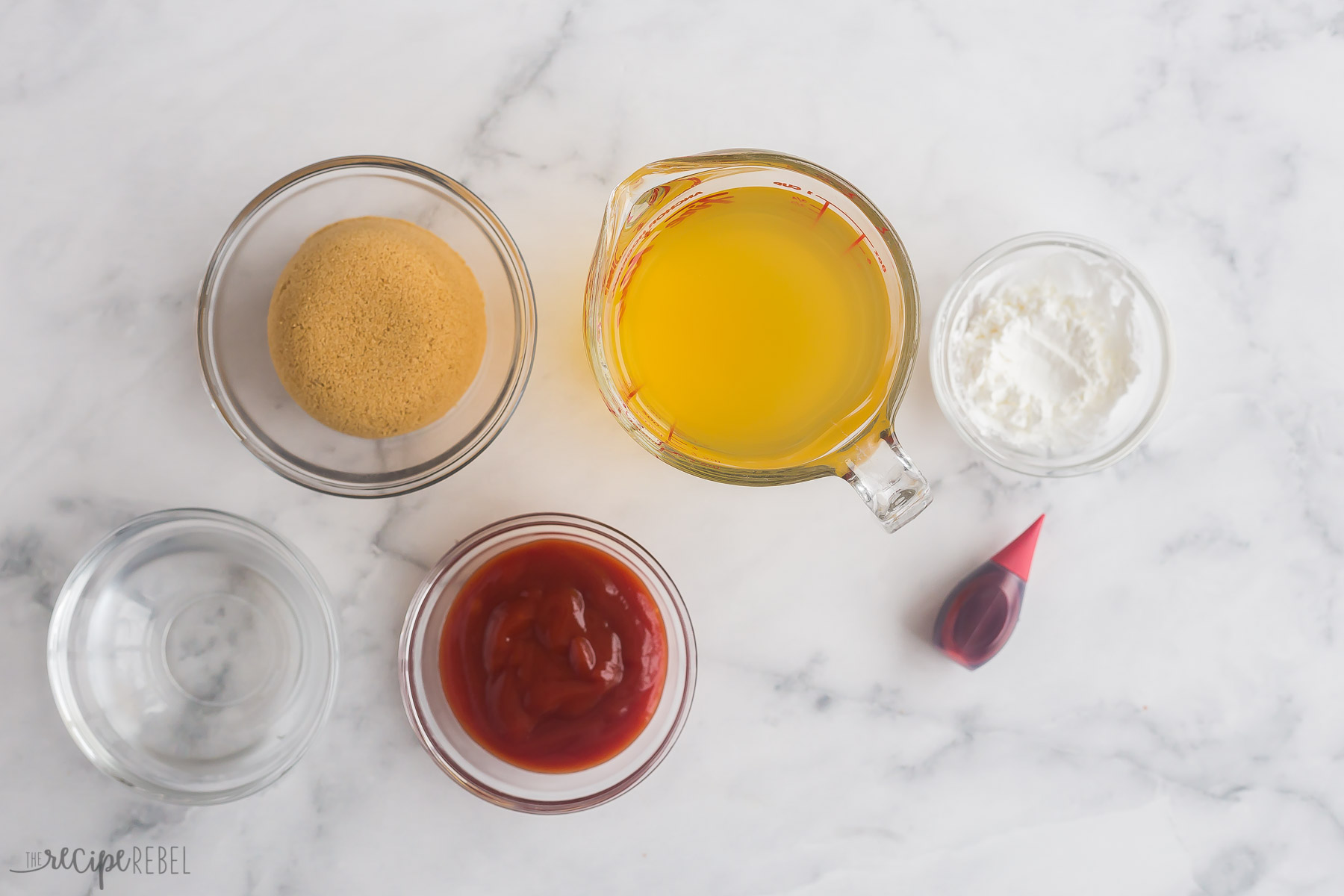 ingredients for sweet and sour sauce laid out on white background