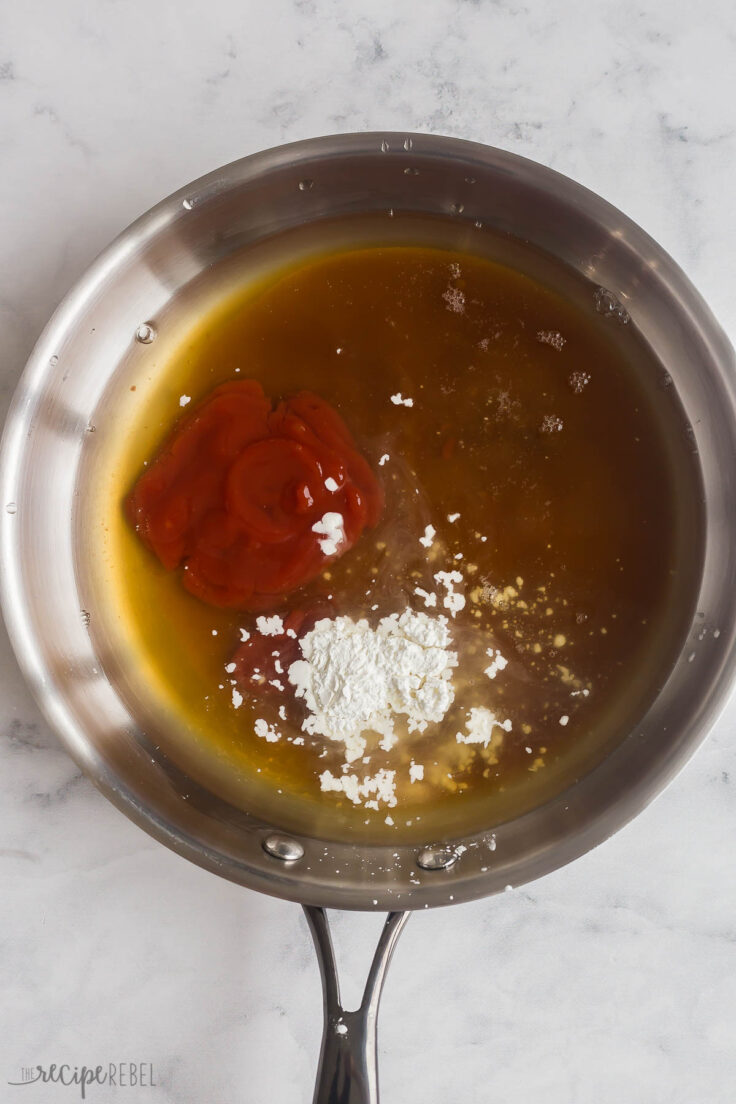 ingredients for sweet and sour sauce in stainless steel skillet