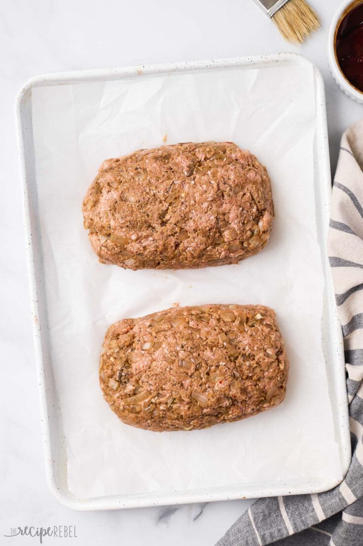 two turkey meatloaves on baking sheet unbaked