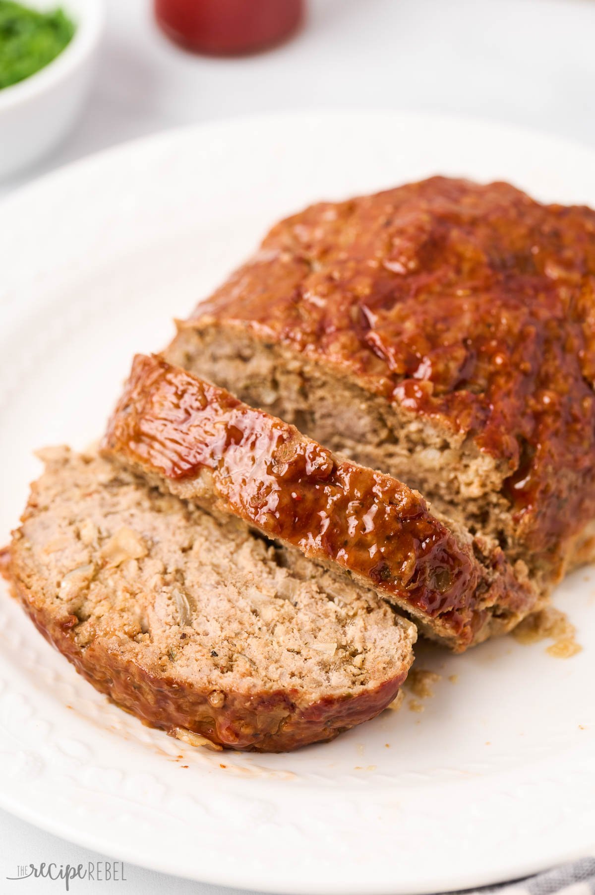 close up image of turkey meatloaf on white platter