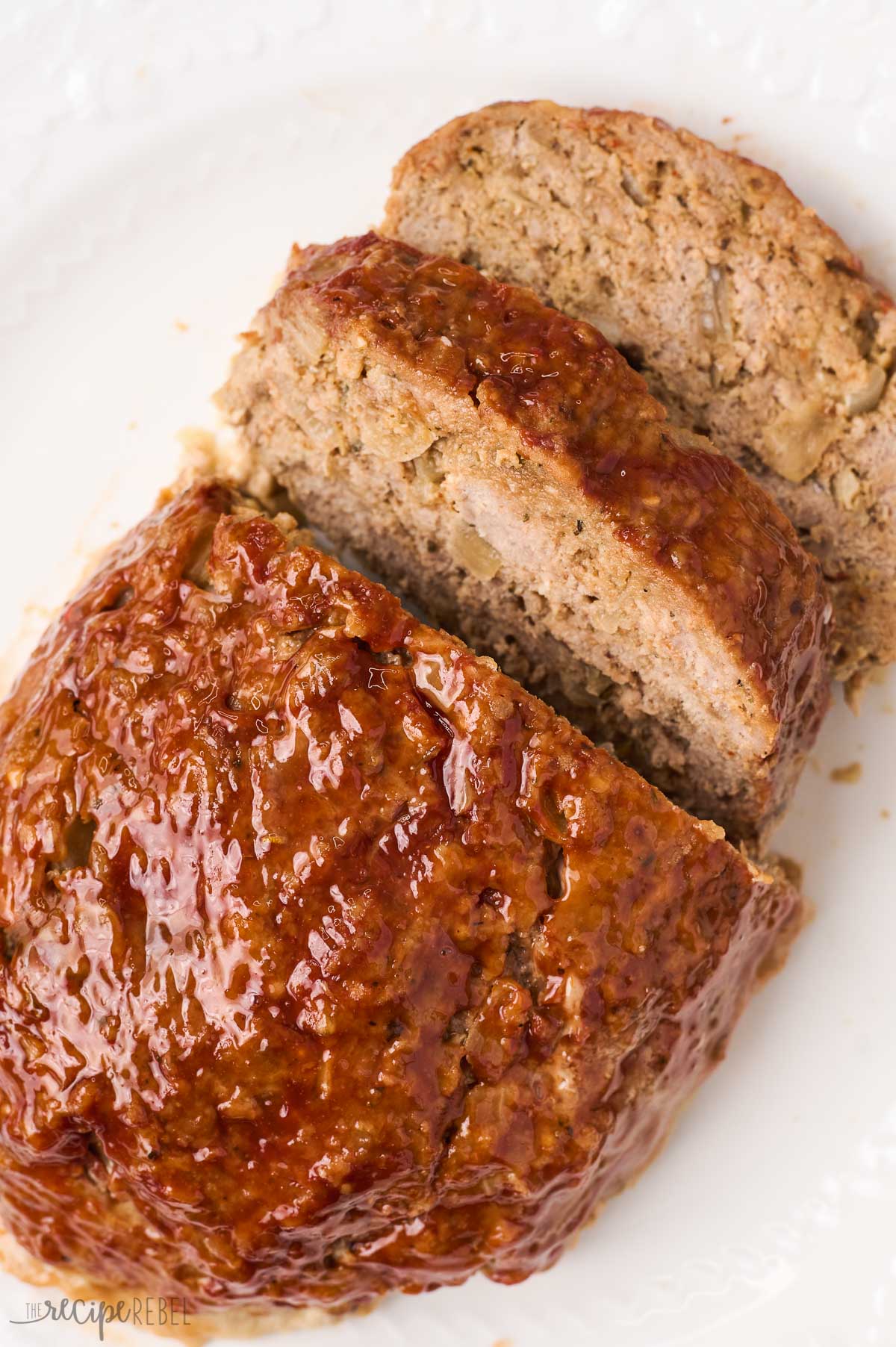 close up image of turkey meatloaf with two slices cut
