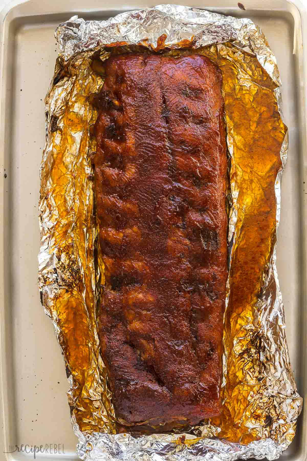 overhead image of ribs from oven cooked and sauced