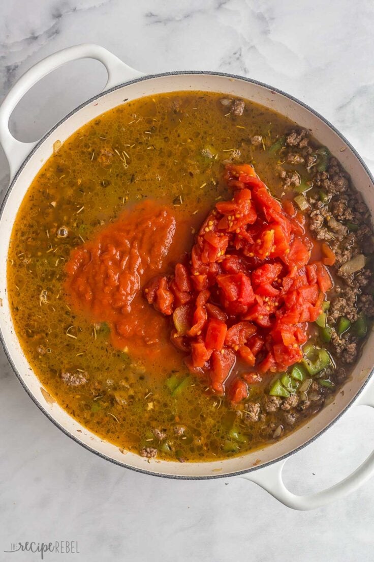 broth and tomatoes added to pan to make goulash